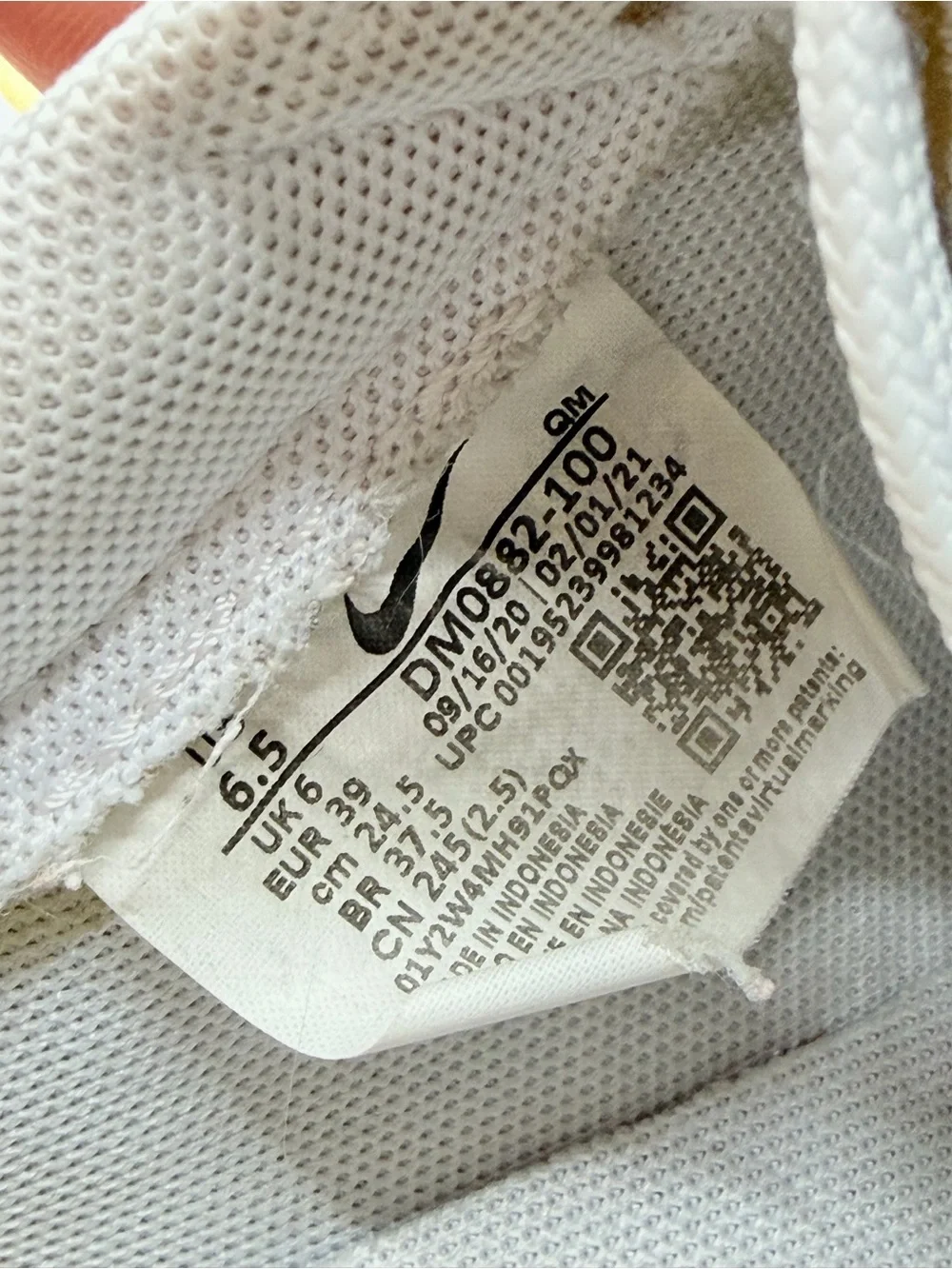 Nike White Low-Top Sneakers with Blue, Green, Yellow and Orange Accents